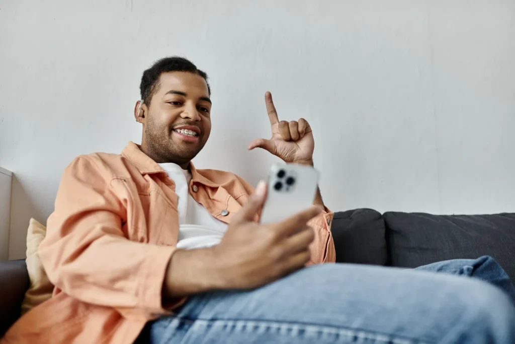 Deaf man talking in sign language on video call