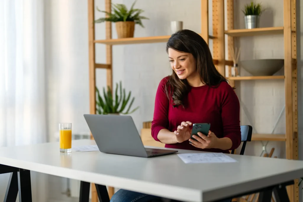 Professional woman using phone to make an NDIS referral